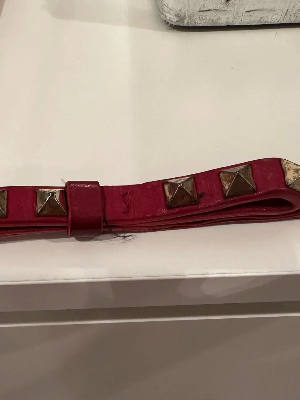 Valentino Garavani Rockstud Key chain Strap in Red with Gold Studs.